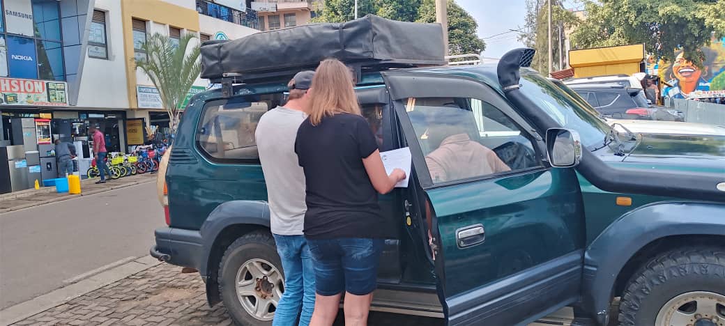 how to book a car in rwanda